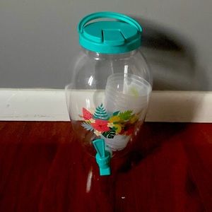 4 cups and A drink dispenser